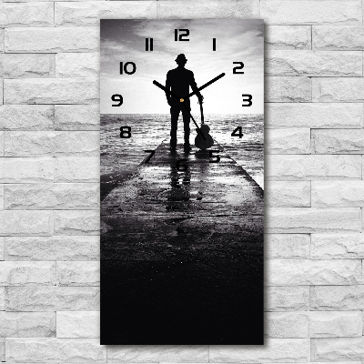 Modern vertical wall clock Guitarist on the pier