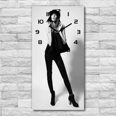 Vertical wall clock A woman in black