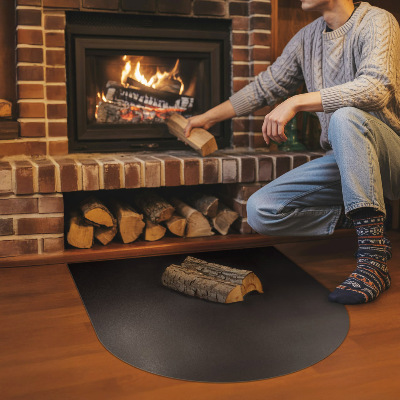 Semi-oval hearth pad for fireplace in industrial metal