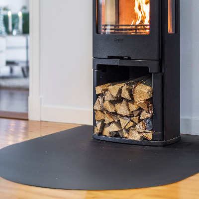 Semi-oval hearth pad for fireplace in industrial metal