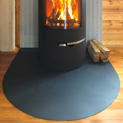 Semi-oval hearth pad for fireplace in industrial metal