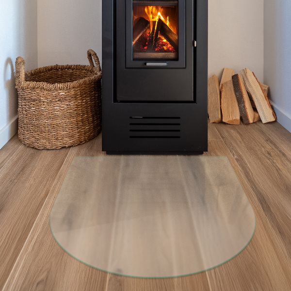 Semi-oval hearth pad for wood stove with a frosted visual effect