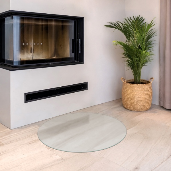 Round wood burner hearth pad with a milky glass optical effect