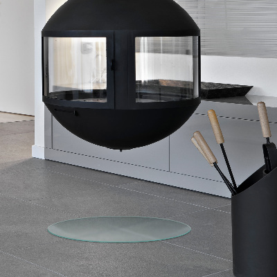 Round wood burner hearth pad with a milky glass optical effect