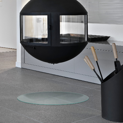 Round wood burner hearth pad with a milky glass optical effect