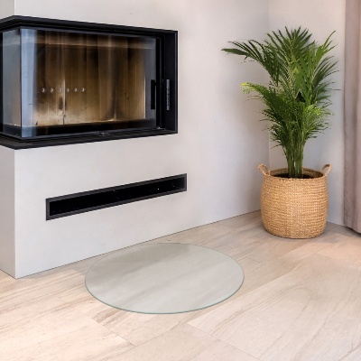 Round wood burner hearth pad with a milky glass optical effect