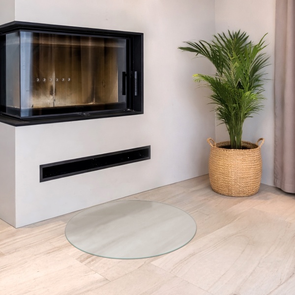 Round wood burner hearth pad with a milky glass optical effect