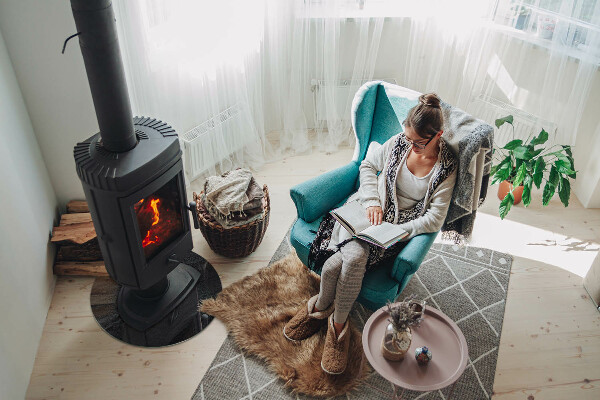 Round glass hearth for log burner Natural stone pattern