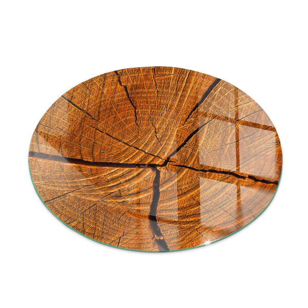 Round glass hearth Wood in cross-section with natural grain