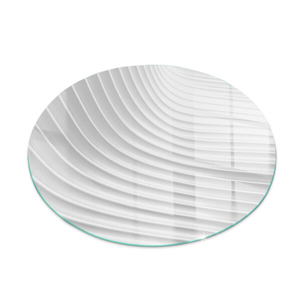 Round glass hearth for log burner Waves of subtle shapes
