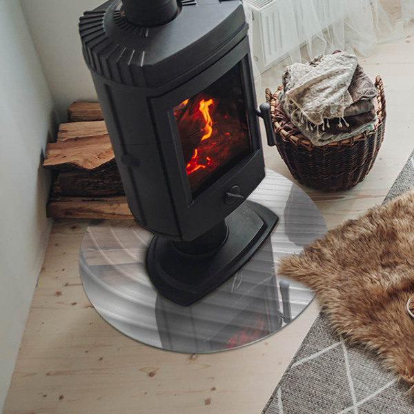 Round glass hearth for log burner Waves of subtle shapes