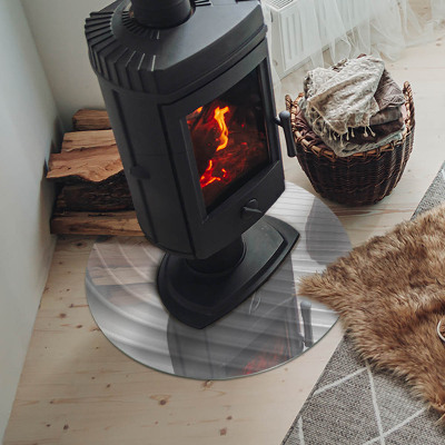 Round glass hearth for log burner Waves of subtle shapes