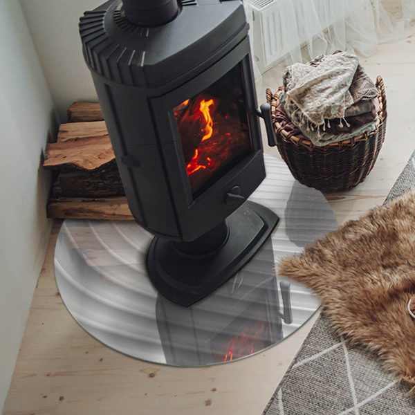 Round glass hearth for log burner Waves of subtle shapes