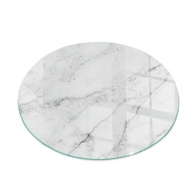 Round glass hearth for log burner Marble accents with delicate veining