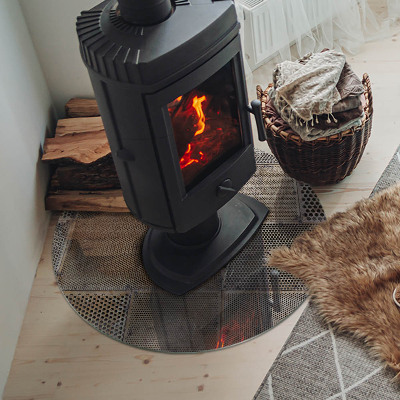 Round glass hearth Perforated steel motif