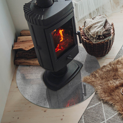 Round glass hearth for log burner Raw concrete pattern