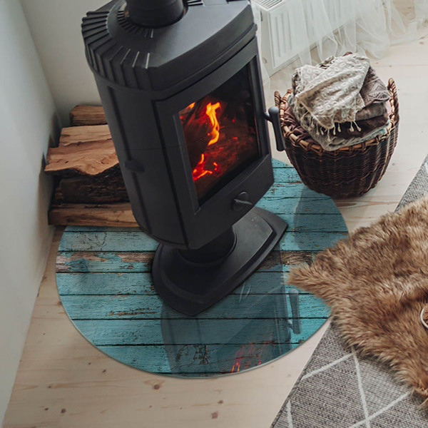 Round glass hearth for log burner Rustic boards in a natural style