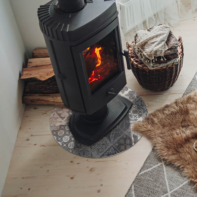 Round glass hearth for log burner Arrangement of mosaic decorations