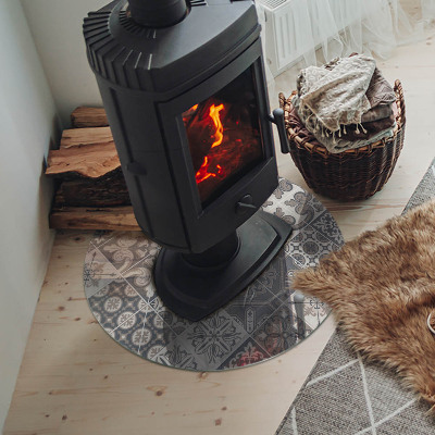 Round glass hearth for log burner Arrangement of mosaic decorations