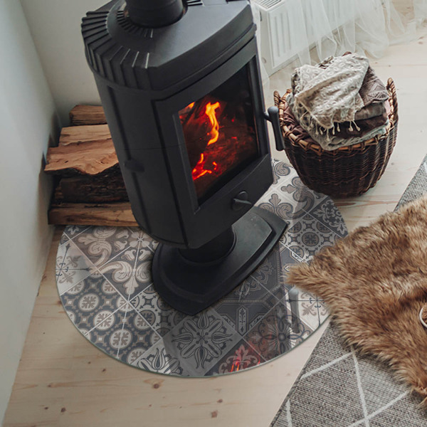 Round glass hearth for log burner Arrangement of mosaic decorations