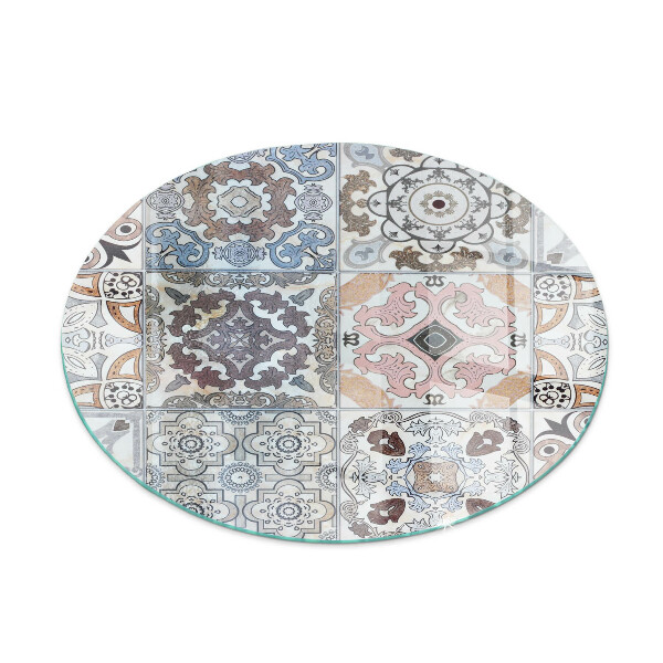 Round glass hearth for log burner Mosaic patterns in tiles