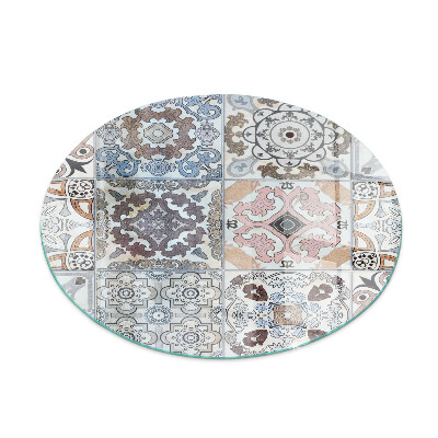 Round glass hearth for log burner Mosaic patterns in tiles
