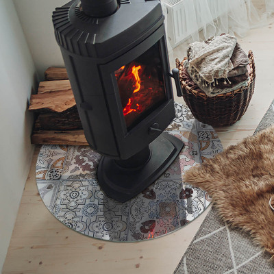 Round glass hearth for log burner Mosaic patterns in tiles