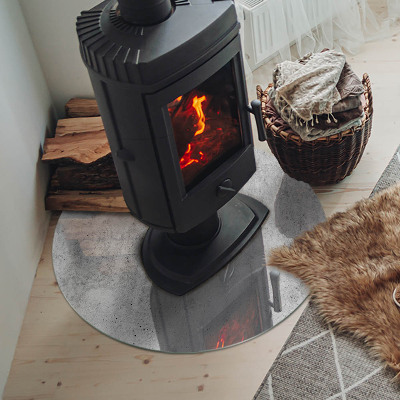 Round tempered glass hearth Raw concrete structure