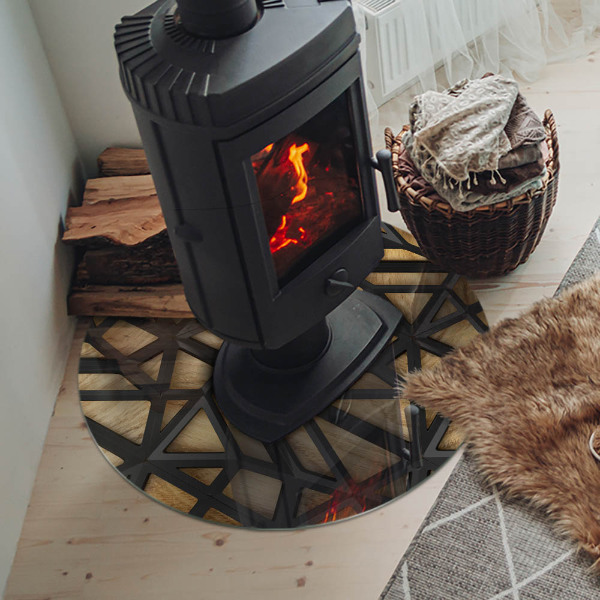 Round glass hearth for log burner Modern shapes with a wooden accent