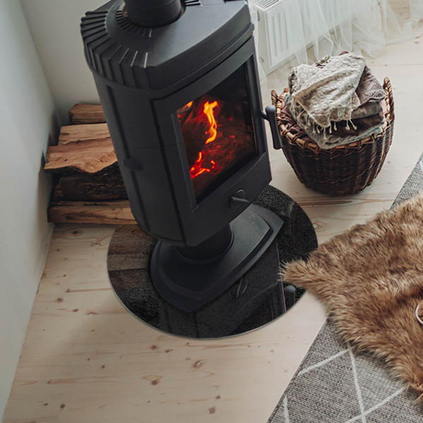 Round glass hearth for log burner Stone structure pattern