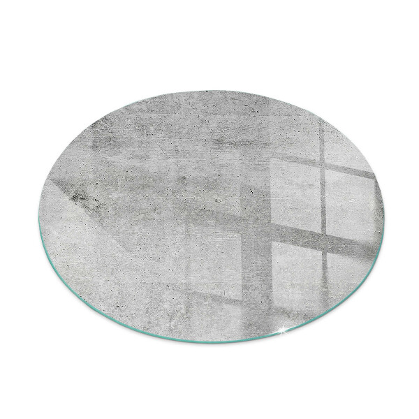 Round glass hearth Raw concrete in a minimalist style