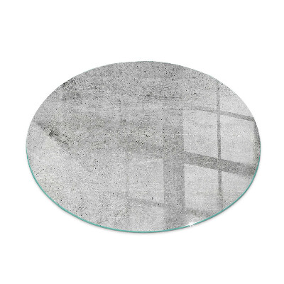 Round glass hearth Raw concrete in a minimalist style