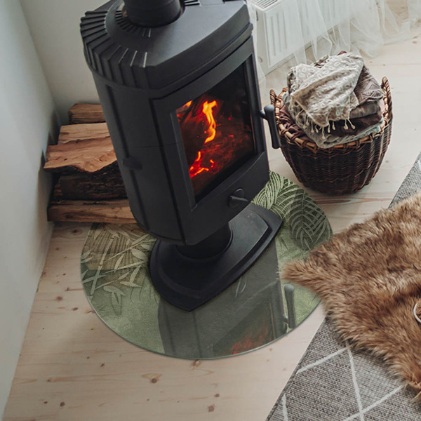 Round glass hearth Tropical leaves on the background