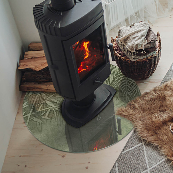 Round glass hearth Tropical leaves on the background