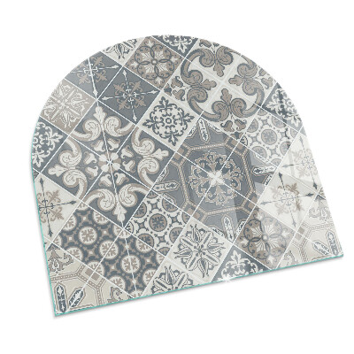 Semi oval glass hearth for stove Arrangement of mosaic decorations