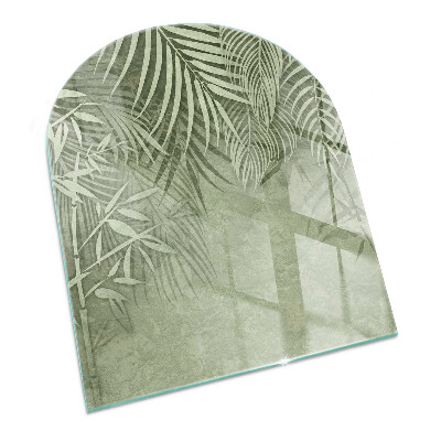 Half round glass hearth Tropical leaves on the background