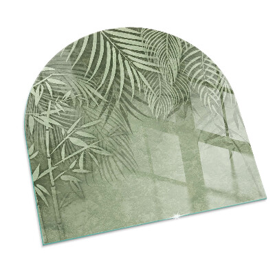Half round glass hearth Tropical leaves on the background