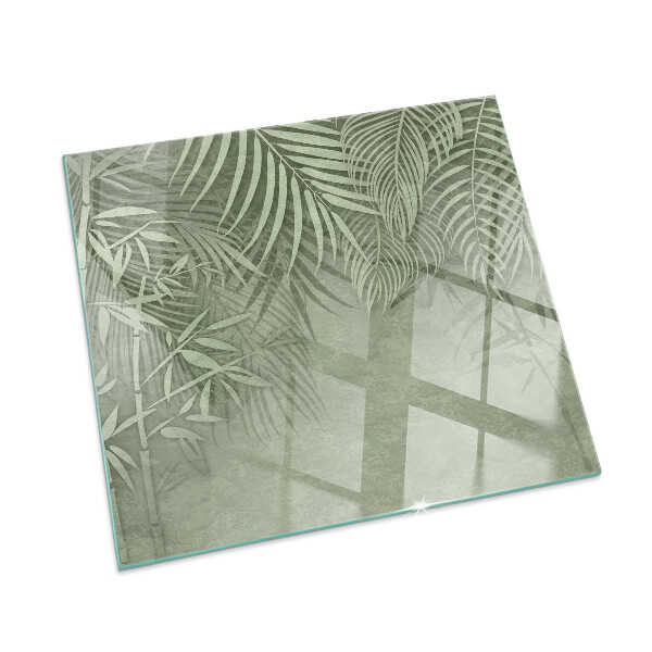Rectangular glass hearth Tropical leaves on the background