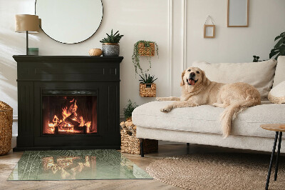 Rectangular glass hearth Tropical leaves on the background