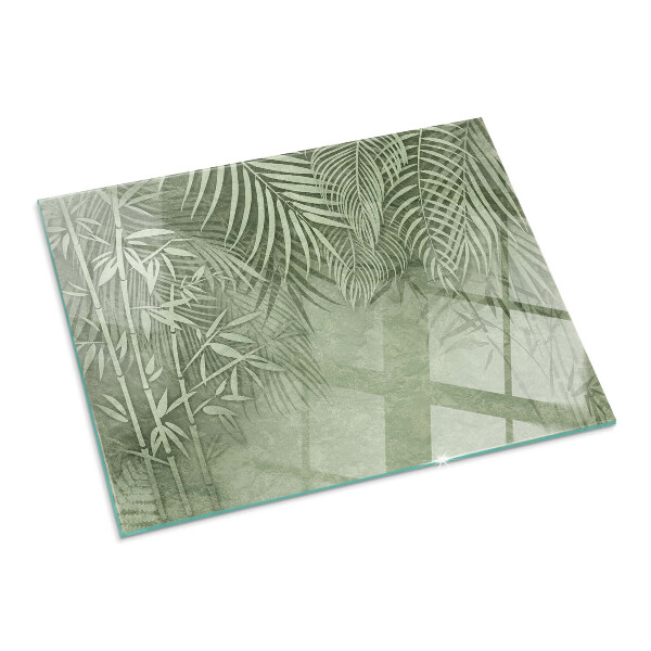 Rectangular glass hearth Tropical leaves on the background