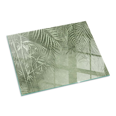 Rectangular glass hearth Tropical leaves on the background