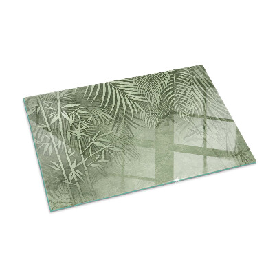 Rectangular glass hearth Tropical leaves on the background