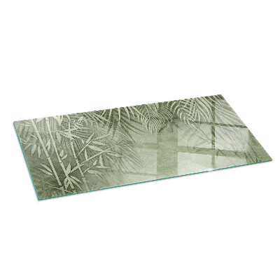 Rectangular glass hearth Tropical leaves on the background