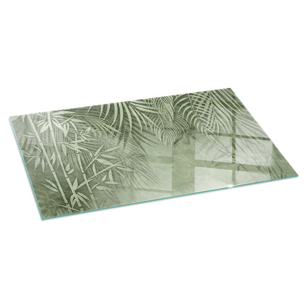 Rectangular glass hearth Tropical leaves on the background