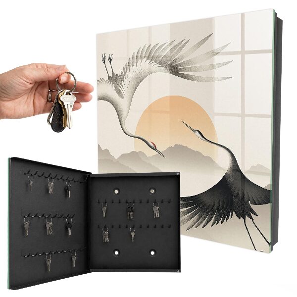 Key box Japanese cranes against the backdrop of the rising sun