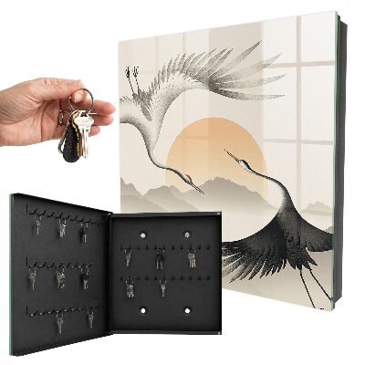 Key box Japanese cranes against the backdrop of the rising sun