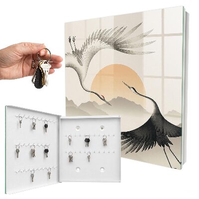 Key box Japanese cranes against the backdrop of the rising sun