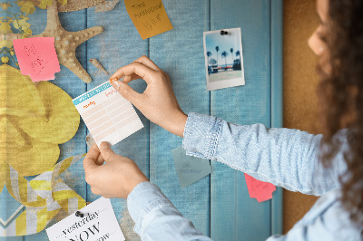 Cork notice board Summer accessories against a blue wooden background