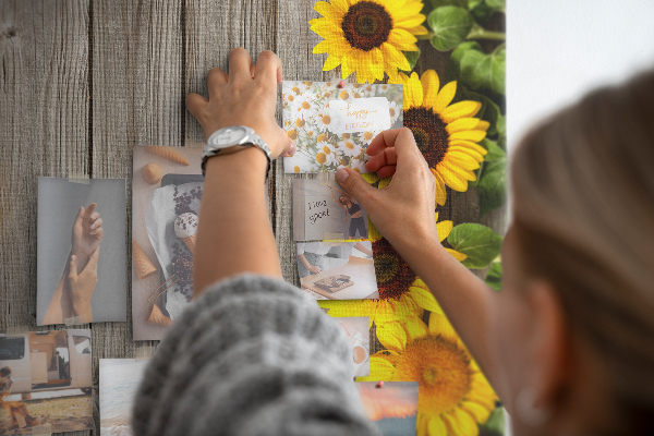 Cork notice board Sunflowers on a wooden board background
