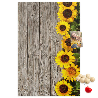 Cork notice board Sunflowers on a wooden board background